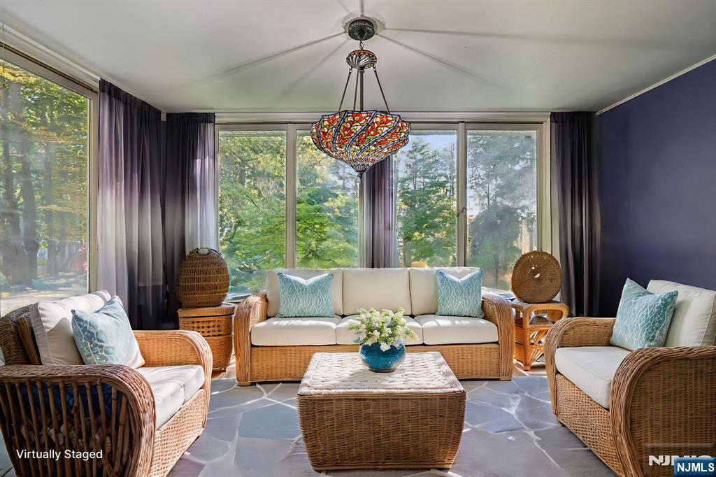 59 Old Stone Church Road Upper Saddle River, NJ 07458 - Photo 9 of 24 a living room with furniture and a large window