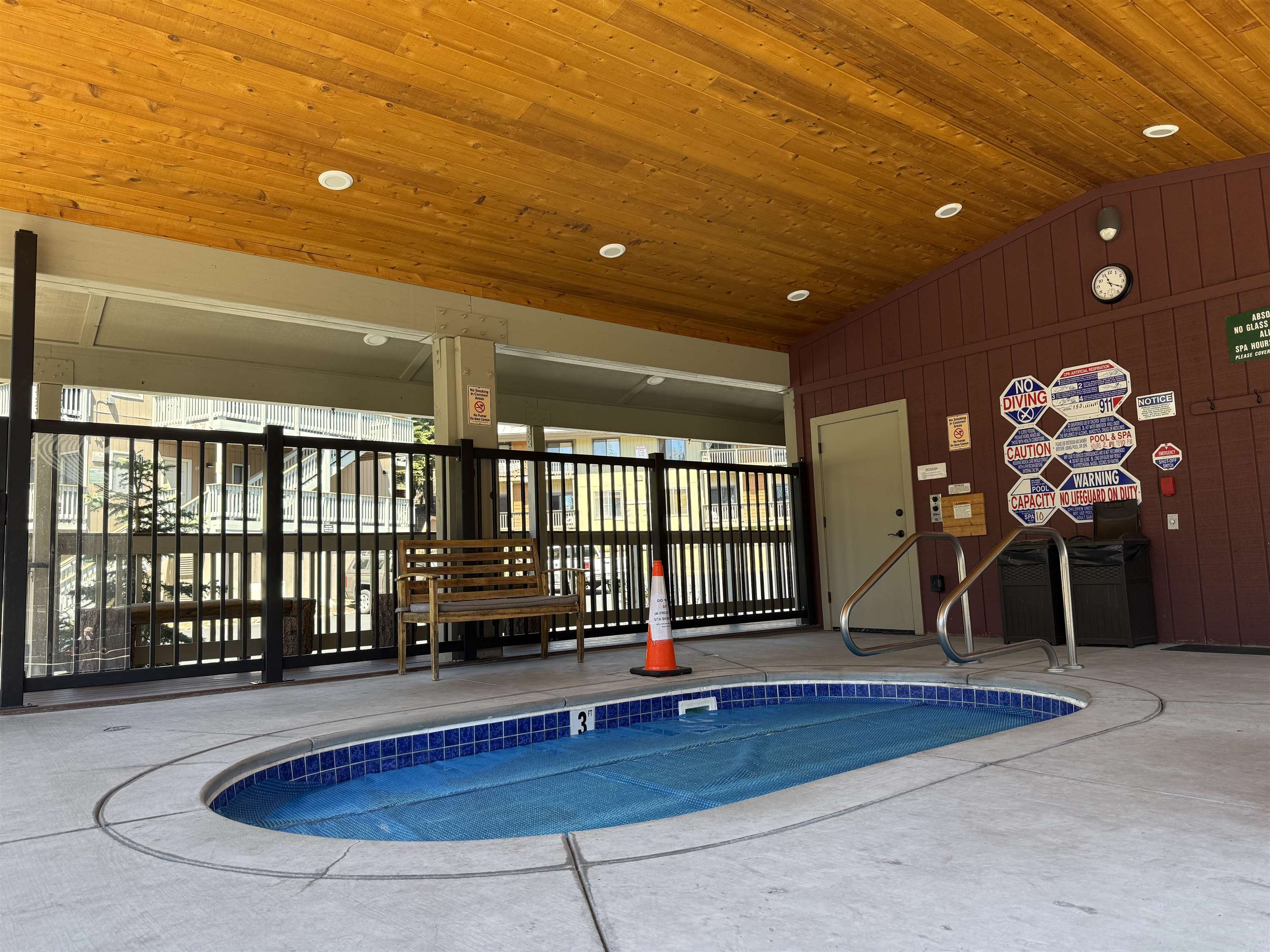 153 Lake Mary Road, Unit 114 Mammoth Lakes, CA 93546 - Photo 21 of 22 Covered outdoor spa with blue tile surround and integrated steps