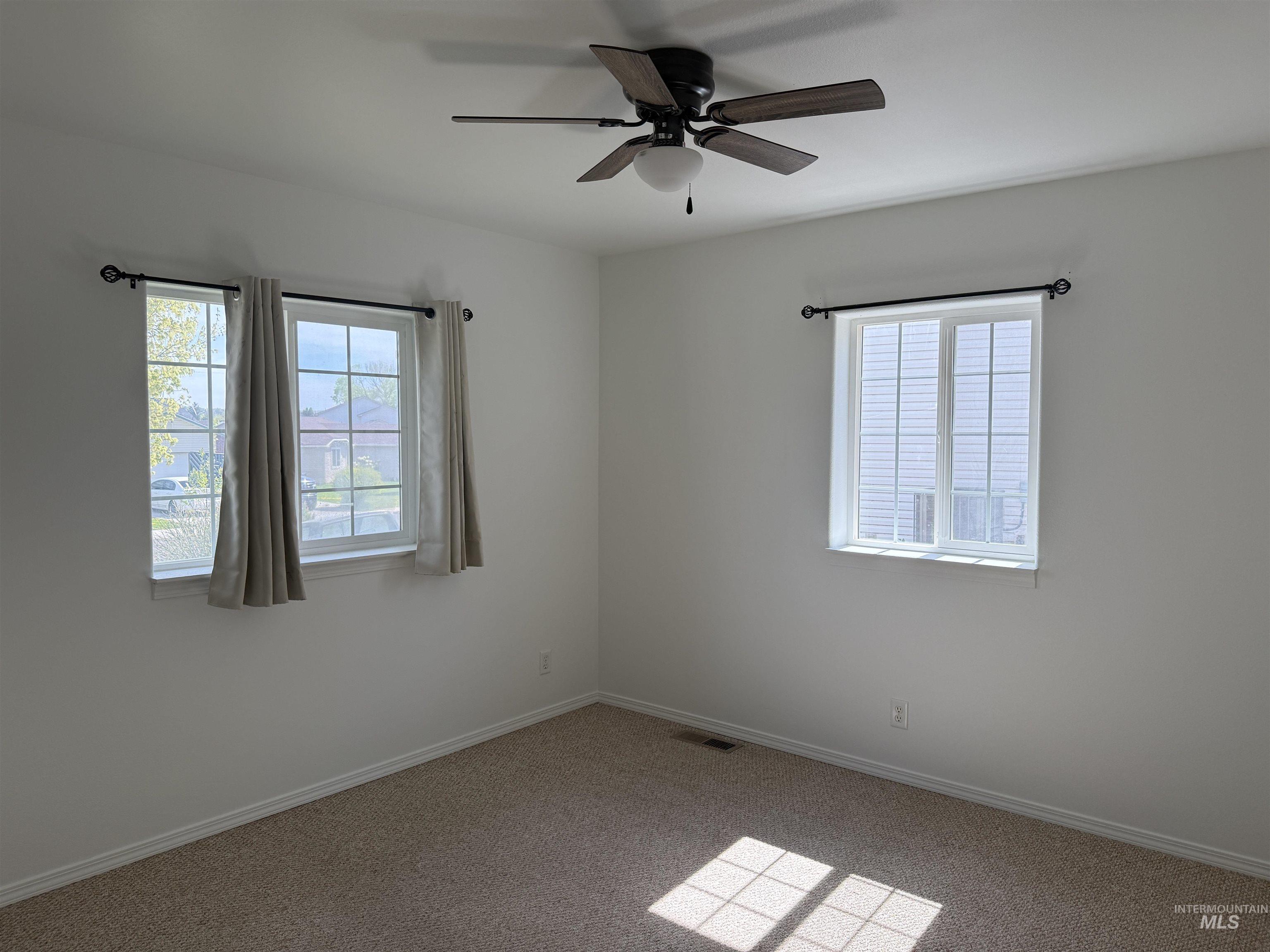 523 Morning Dove Way Marsing, ID 83639 - Photo 18 of 23 Carpeted spare room featuring a ceiling fan and healthy amount of natural light