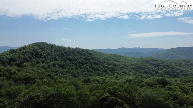 a view of a city with mountains in the background