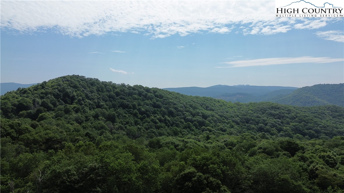 a view of a city with mountains in the background
