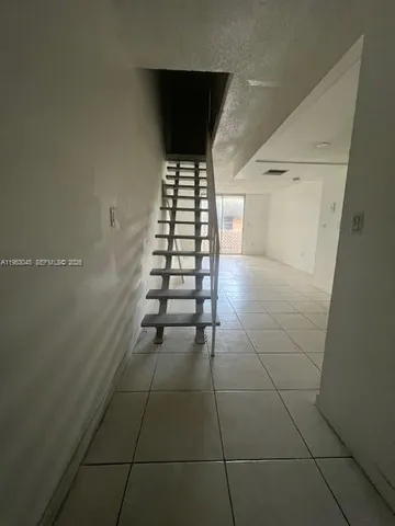 a kitchen with a sink a stove and refrigerator