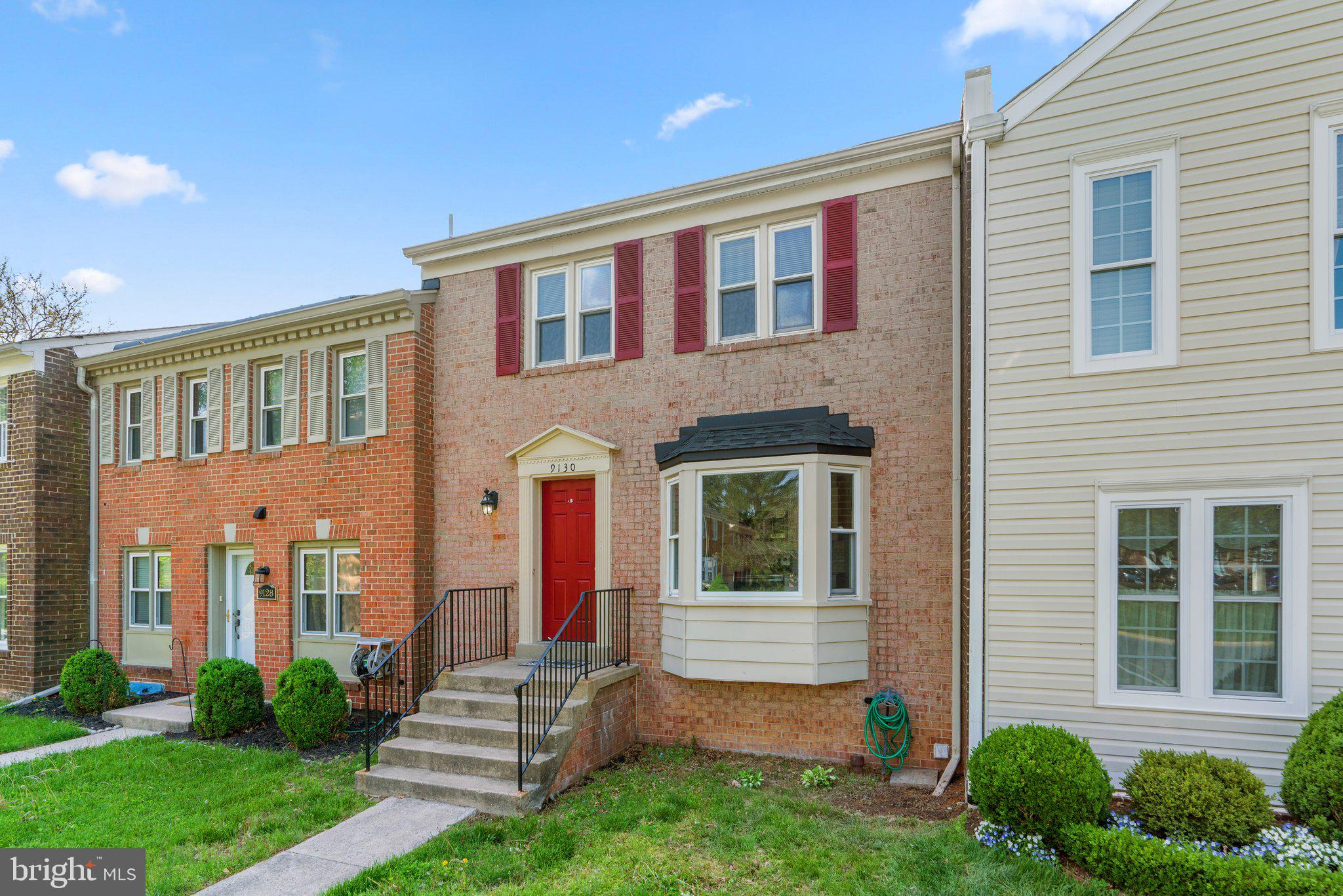 9130 Bobwhite Circle Gaithersburg, MD 20879 - Photo 1 of 36 a front view of a house with garden