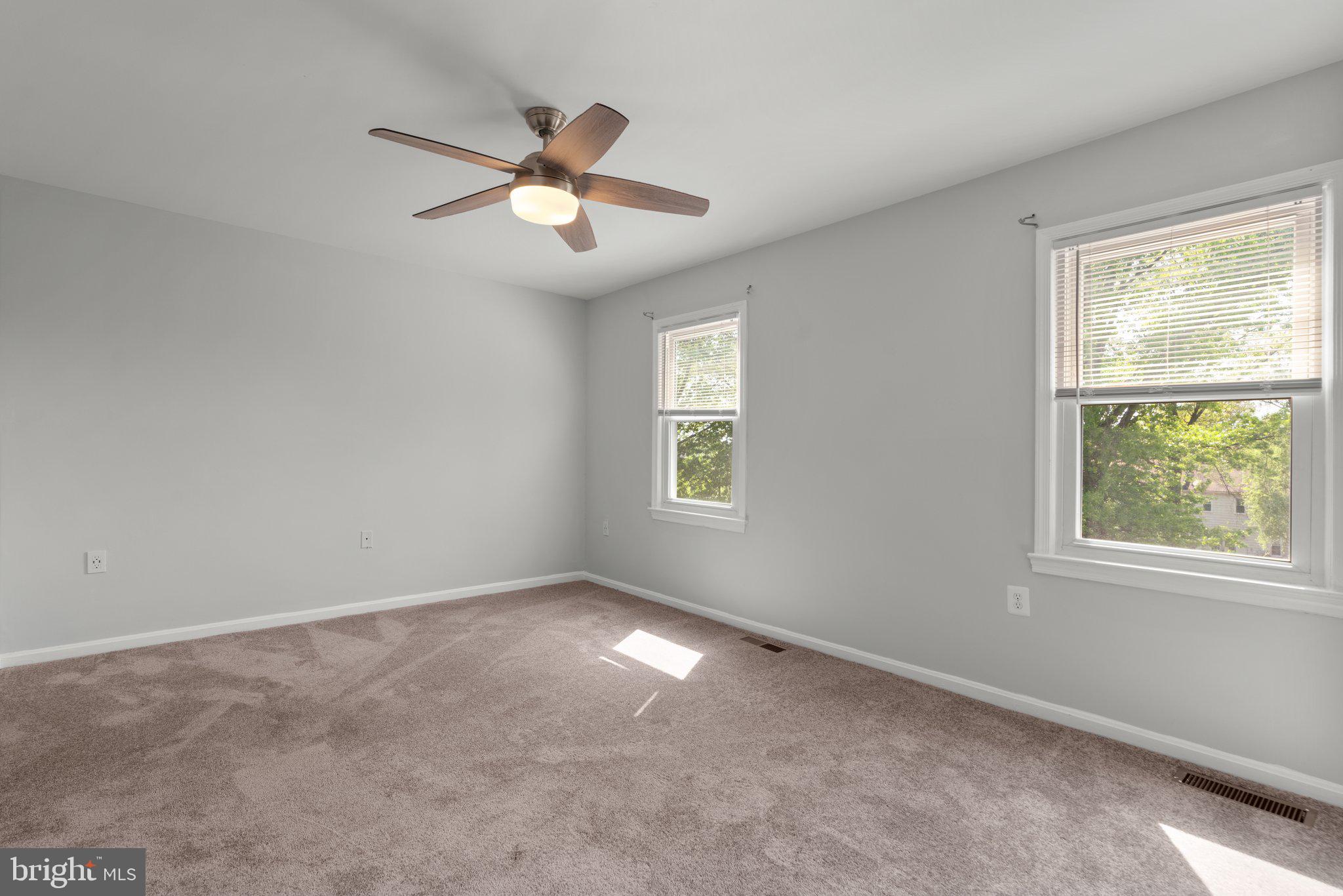 9130 Bobwhite Circle Gaithersburg, MD 20879 - Photo 22 of 36 a view of a big room with windows and chandelier fan