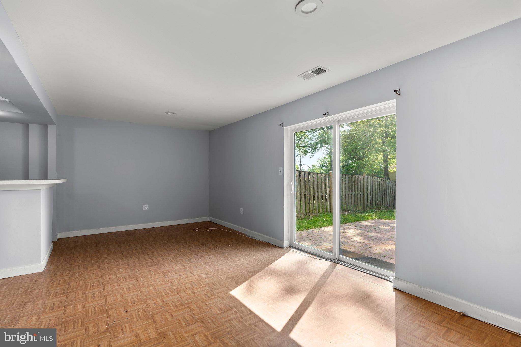9130 Bobwhite Circle Gaithersburg, MD 20879 - Photo 29 of 36 a view of a room with sliding glass door