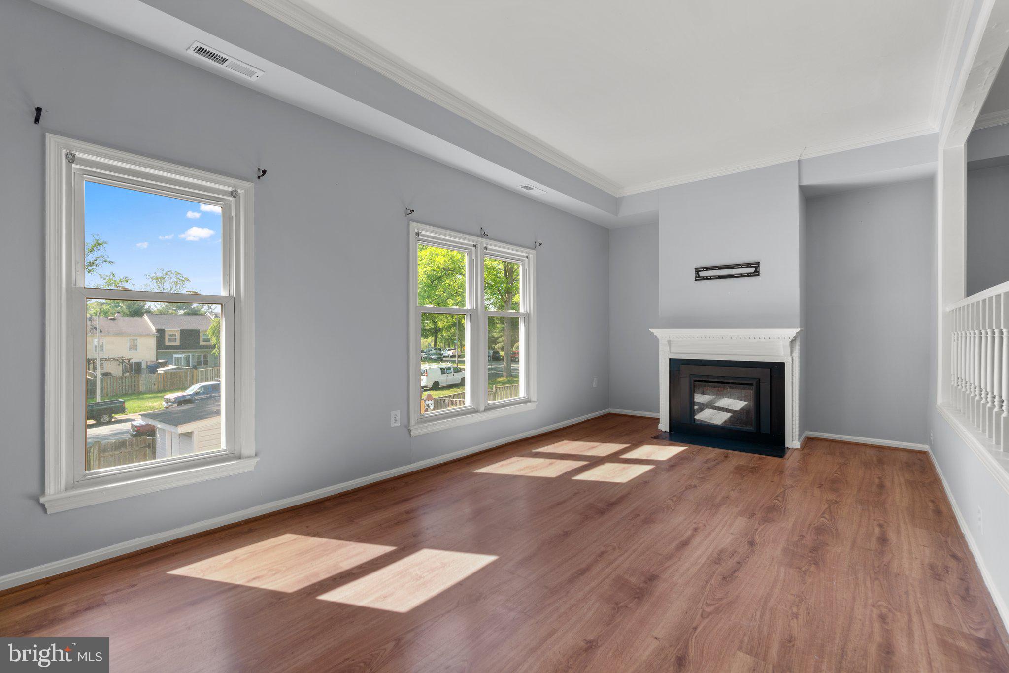 9130 Bobwhite Circle Gaithersburg, MD 20879 - Photo 3 of 36 a view of an empty room with window and fire place