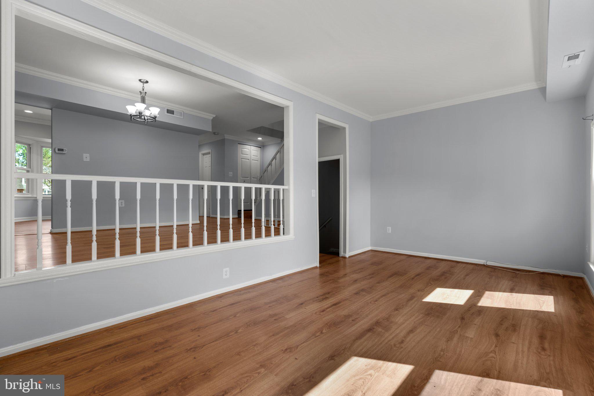 9130 Bobwhite Circle Gaithersburg, MD 20879 - Photo 5 of 36 a view of an empty room with wooden floor