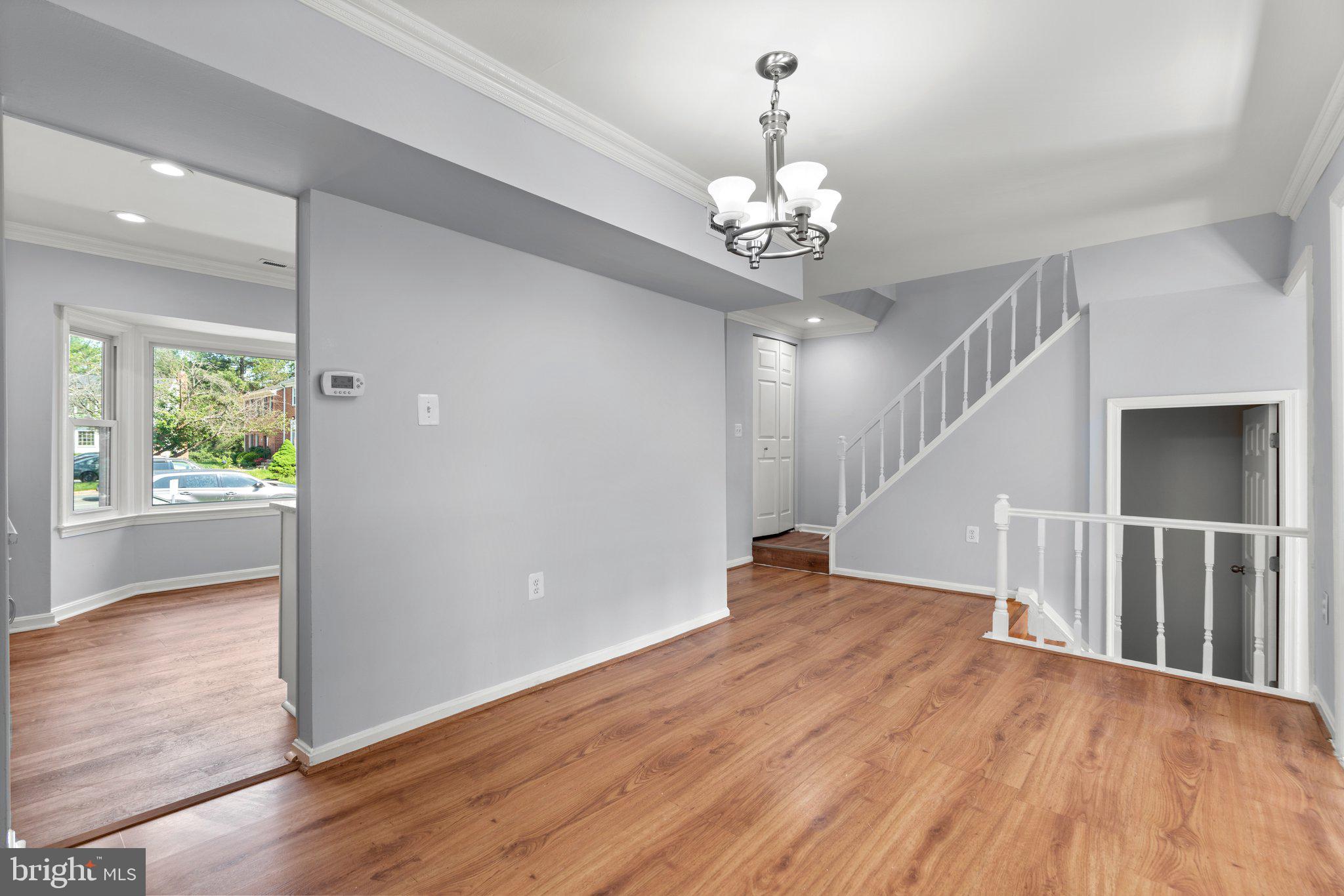 9130 Bobwhite Circle Gaithersburg, MD 20879 - Photo 9 of 36 an empty room with wooden floor and windows