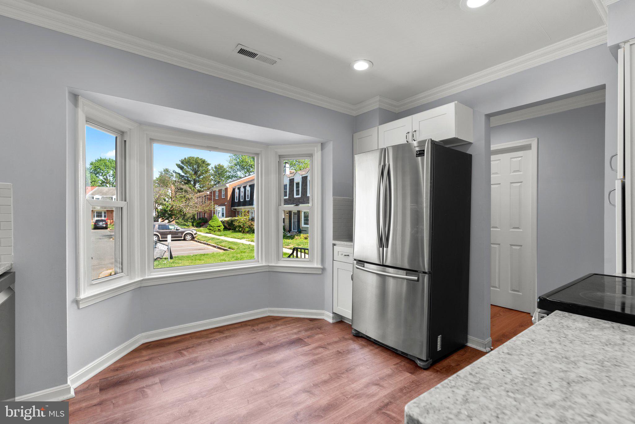 9130 Bobwhite Circle Gaithersburg, MD 20879 - Photo 10 of 36 a kitchen with stainless steel appliances granite countertop a refrigerator and a window