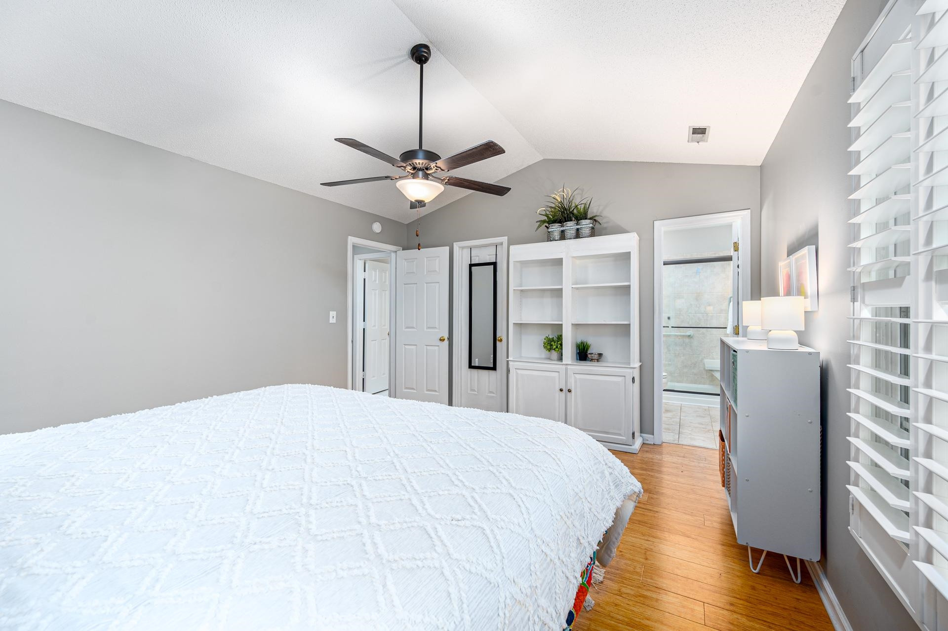 118 Long Shadow Place Durham, NC 27713 - Photo 12 of 24 a bedroom with a large bed and a chandelier