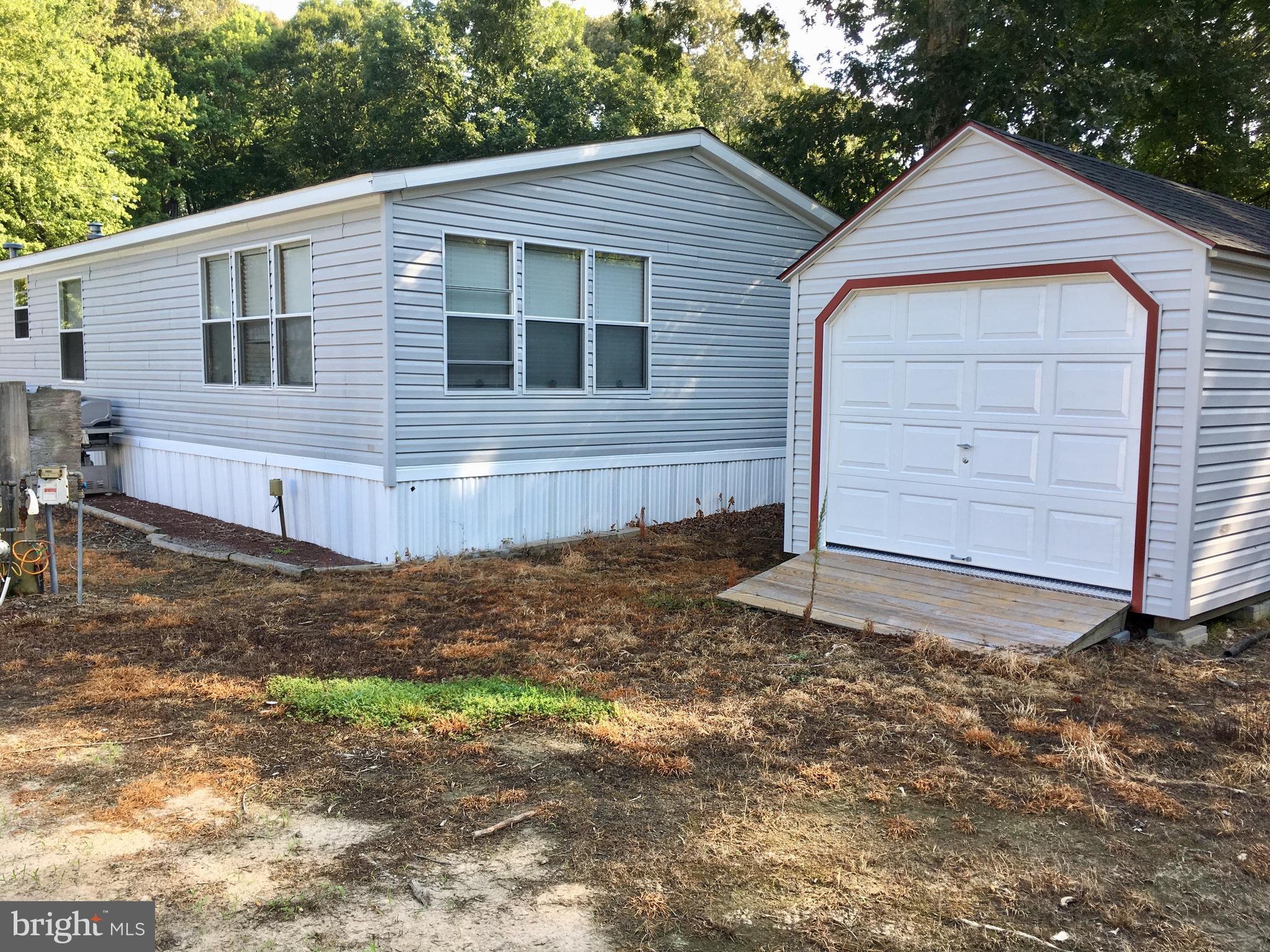Back of home with Roll in shed