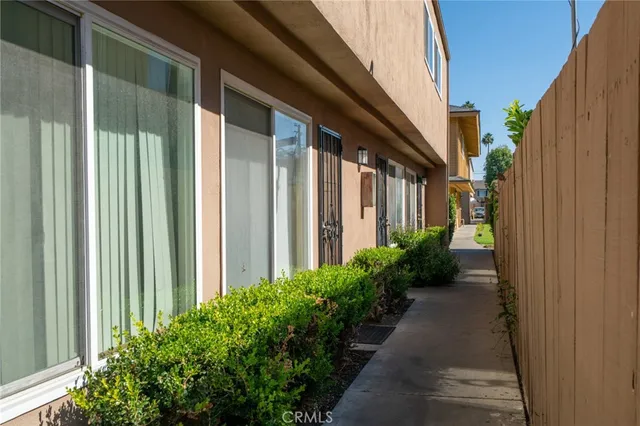 a view of a pathway besides a house