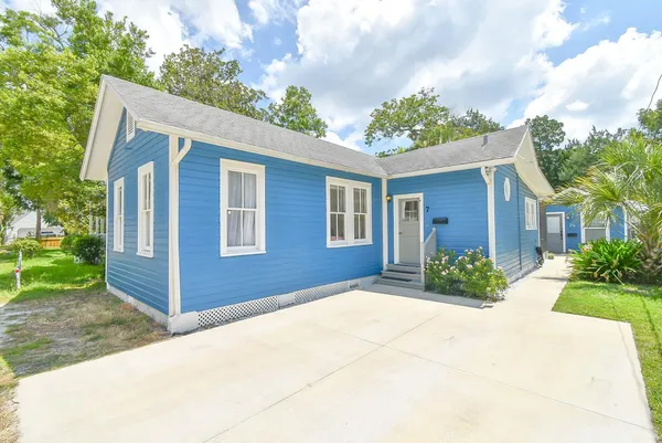 a front view of a house with garden