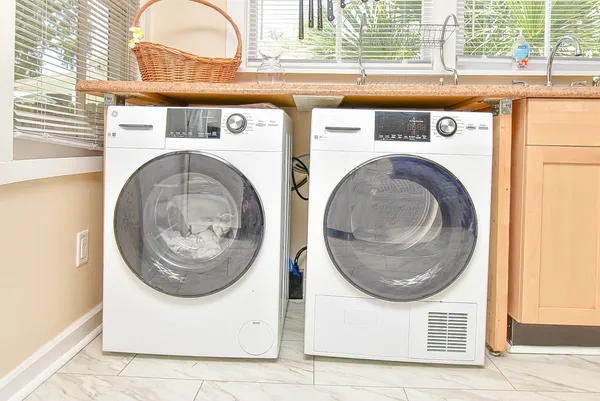 a utility room with dryer and washer
