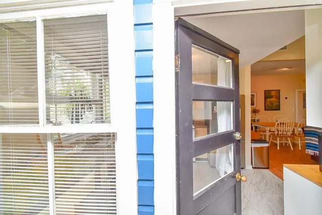 a view of front door of house and window