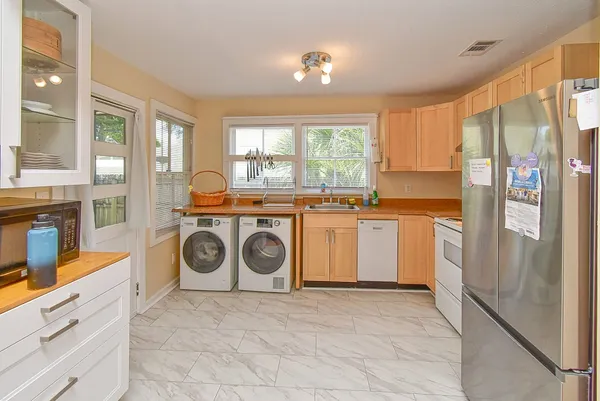 a kitchen with a stove top oven sink and cabinets