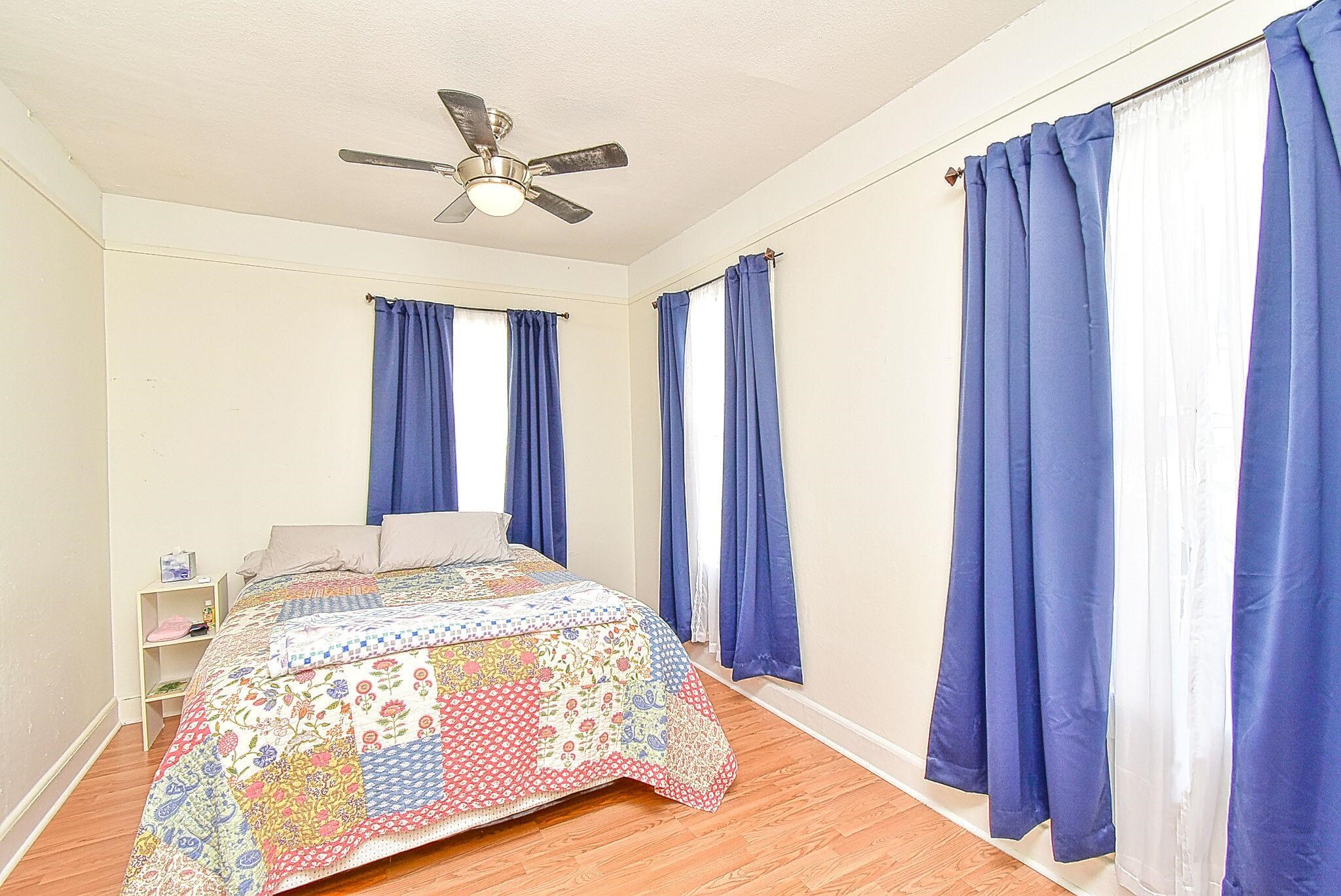 7 Dupont Lane St. Augustine, FL 32084 - Photo 4 of 39 a bedroom with a bed and a chandelier