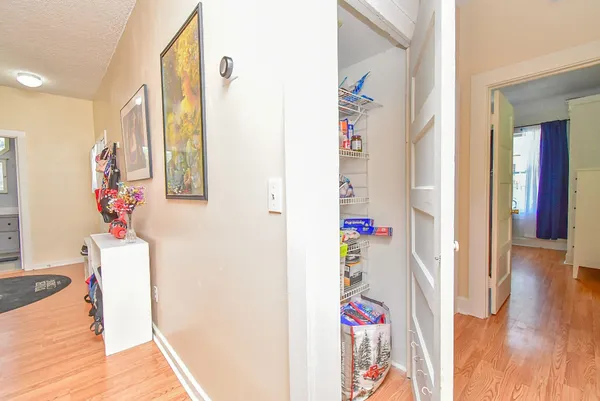 a view of an entryway with wooden floor