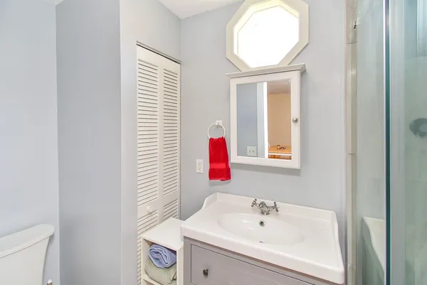a bathroom with a sink and a mirror