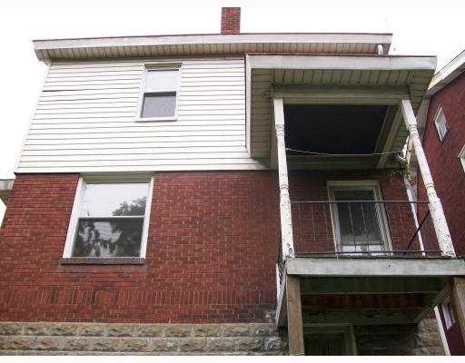1808 Warren Street Fineview, PA 15212 - Photo 17 of 18 Exterior Front. From rear. Porch supports being painted