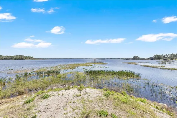 a view of lake with green space