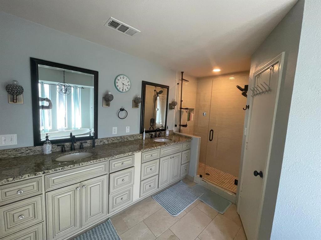 3612 Cross Bend Road Plano, TX 75023 - Photo 26 of 38 Bathroom with tile floors, a shower with door, and double sink vanity