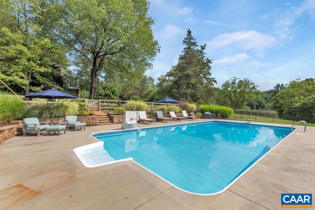 550 Grassmere Road Charlottesville, VA 22903 - Photo 54 of 75 a view of a swimming pool with a lounge chair