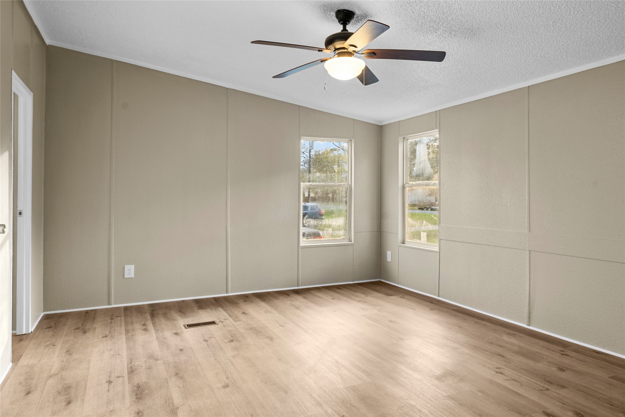 12902 Indian Ridge Drive Dayton, TX 77535 - Photo 14 of 31 wooden floor in an empty room with a window