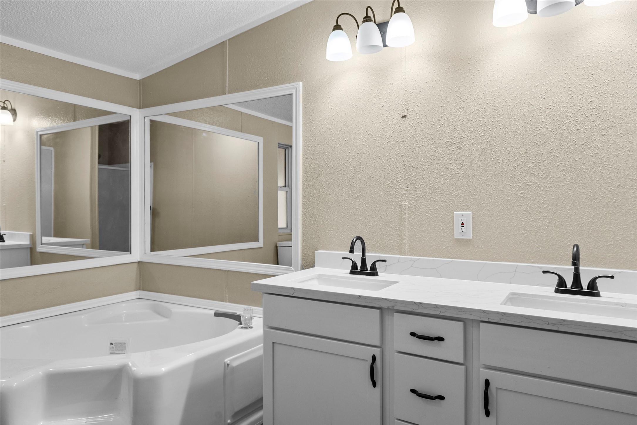 12902 Indian Ridge Drive Dayton, TX 77535 - Photo 18 of 31 a bathroom with a sink and a tub