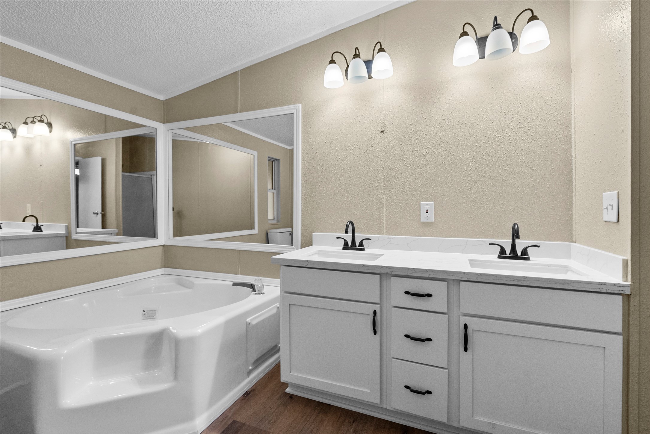 12902 Indian Ridge Drive Dayton, TX 77535 - Photo 19 of 31 a bathroom with a double vanity sink mirror and