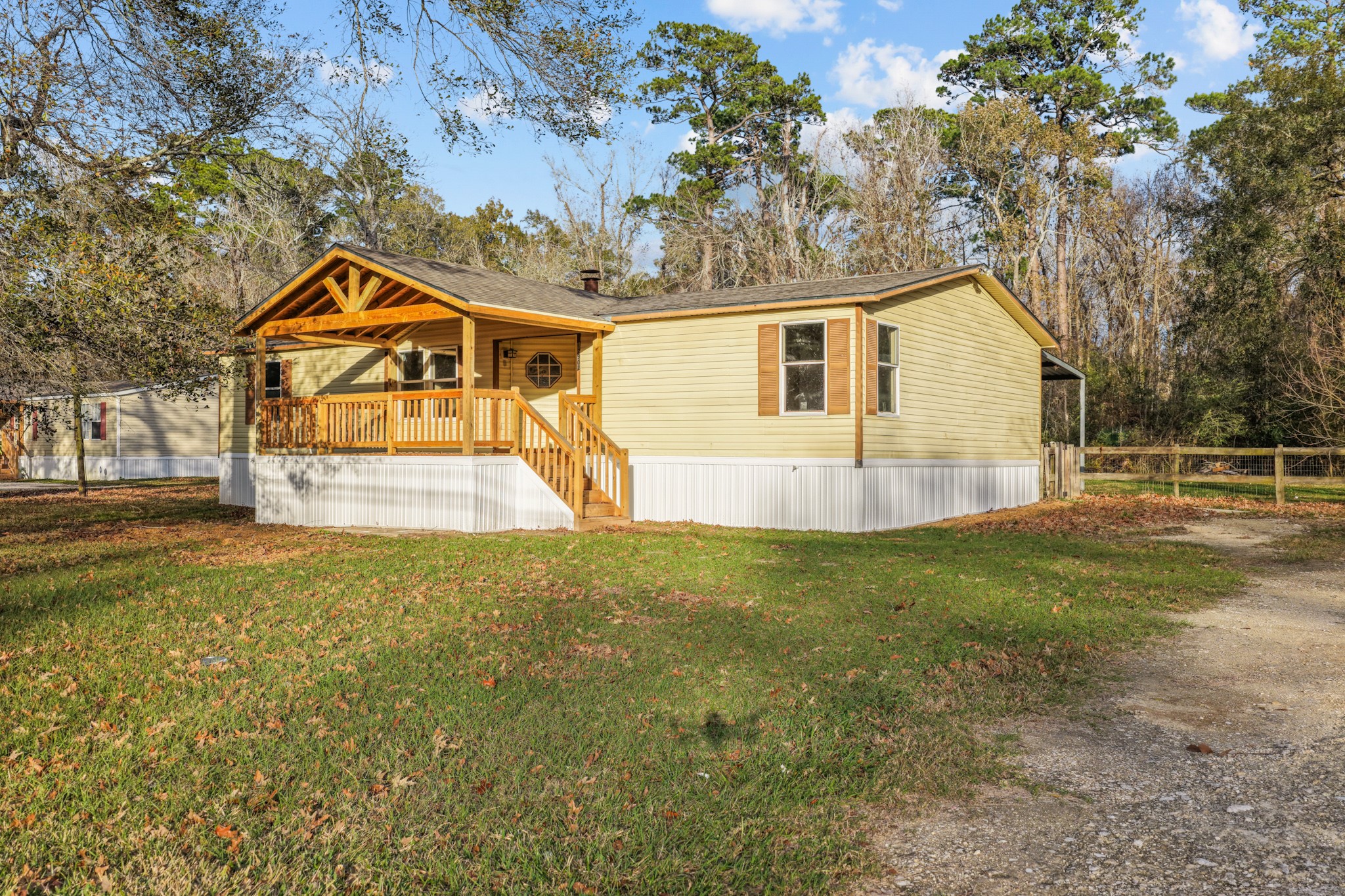 12902 Indian Ridge Drive Dayton, TX 77535 - Photo 2 of 31 a view of a house with a yard