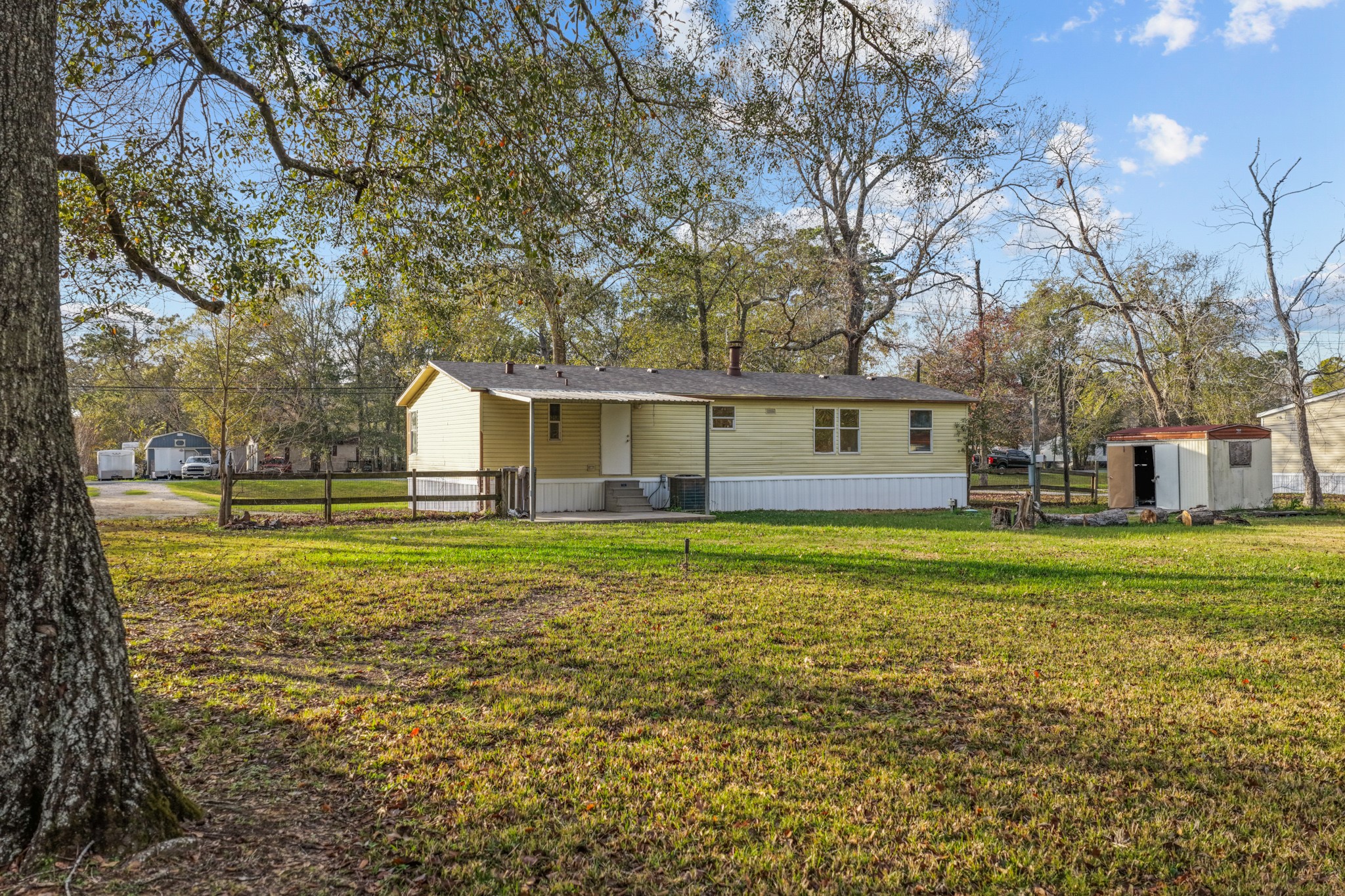 12902 Indian Ridge Drive Dayton, TX 77535 - Photo 27 of 31 a view of a house with a yard