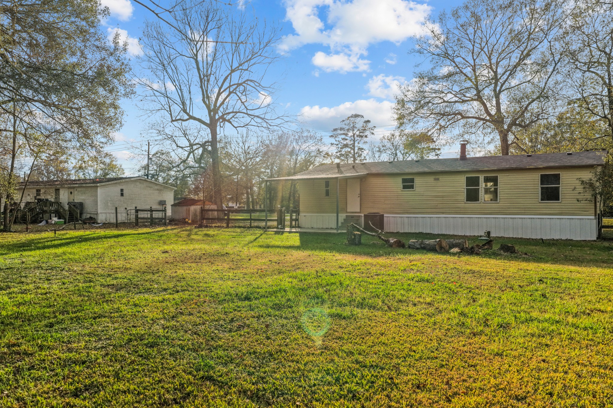 12902 Indian Ridge Drive Dayton, TX 77535 - Photo 29 of 31 a view of a house with a yard