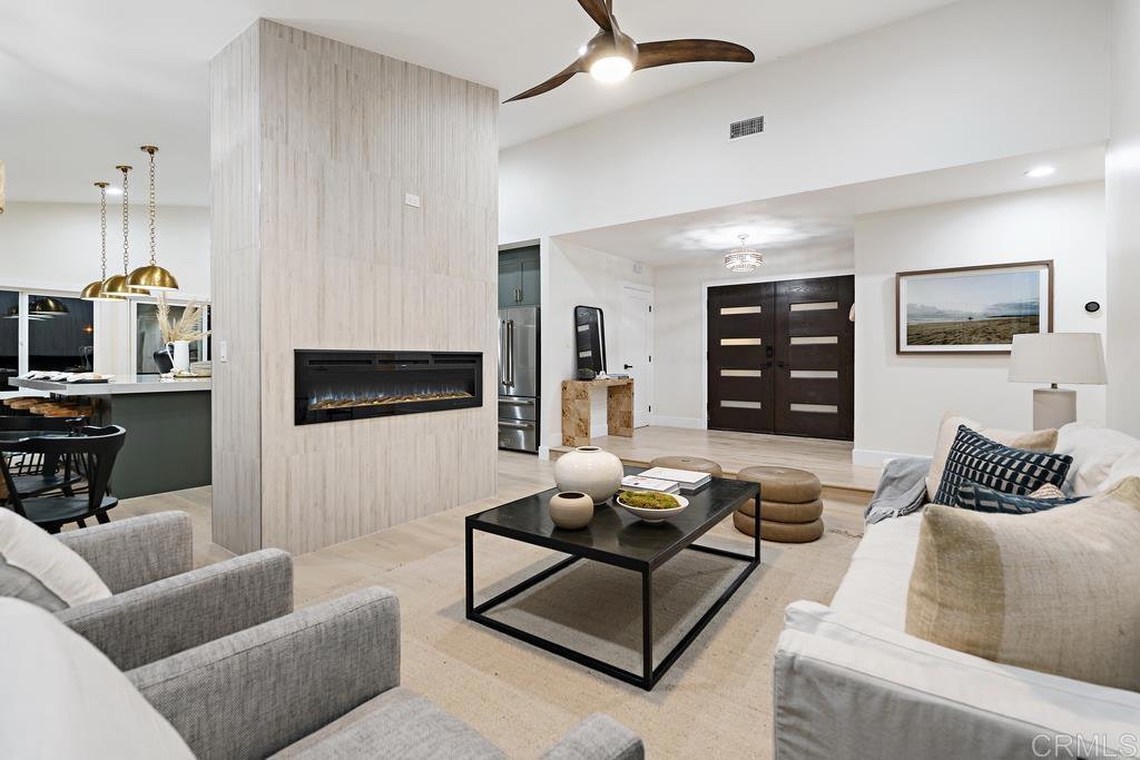 14224 Recuerdo Drive Del Mar, CA 92014 - Photo 1 of 21 a living room with furniture and a flat screen tv