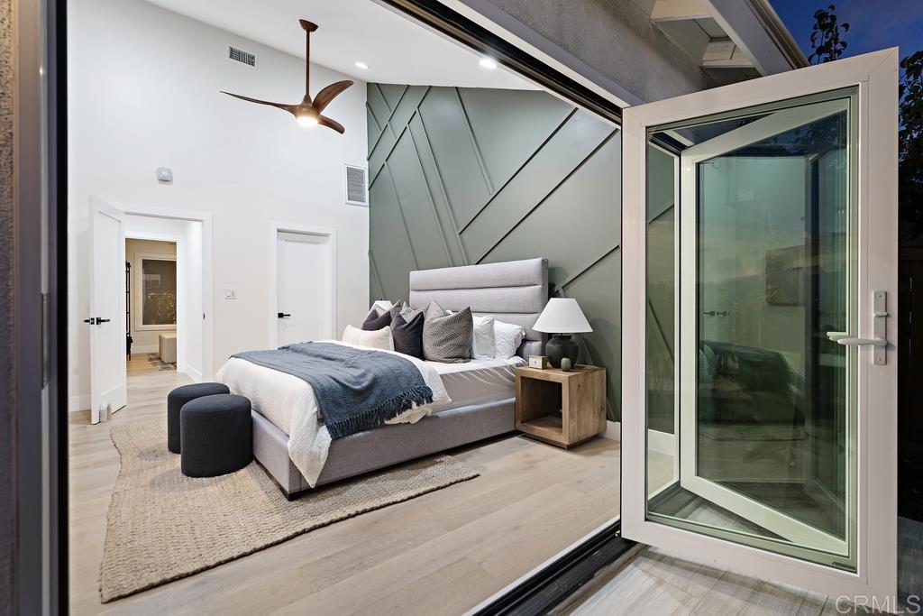 14224 Recuerdo Drive Del Mar, CA 92014 - Photo 11 of 21 a bedroom with a bed and a mirror