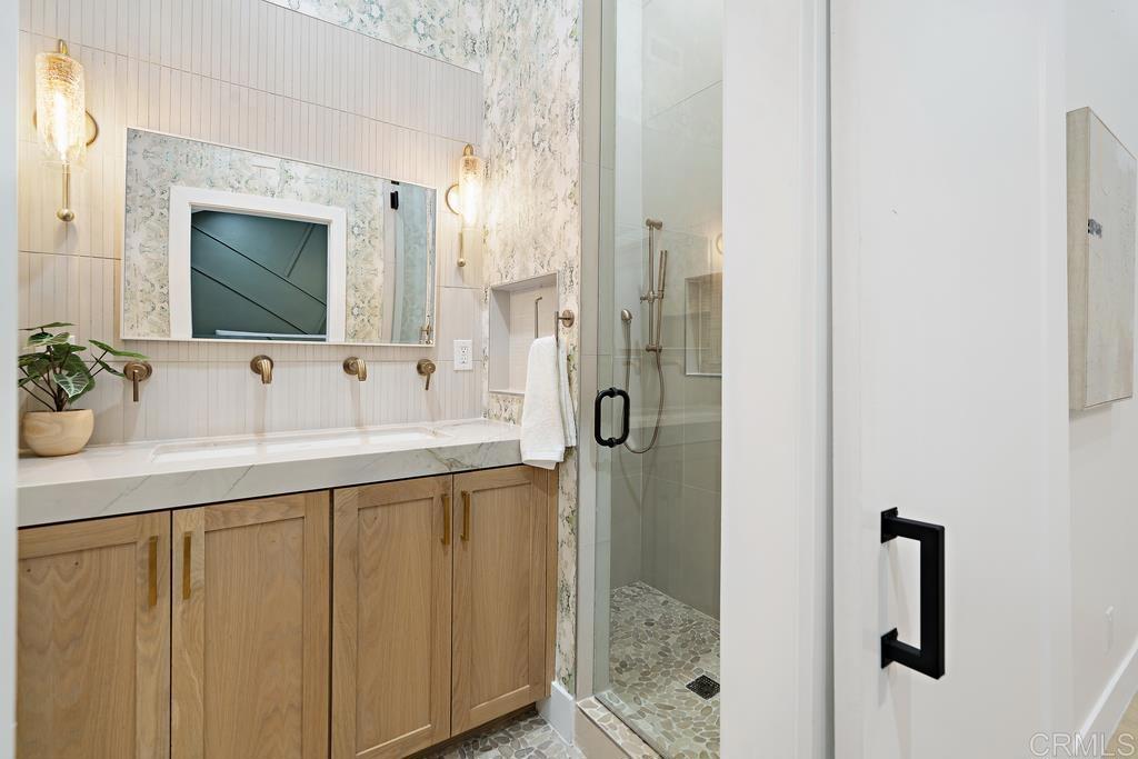 14224 Recuerdo Drive Del Mar, CA 92014 - Photo 12 of 21 a bathroom with a sink and a mirror