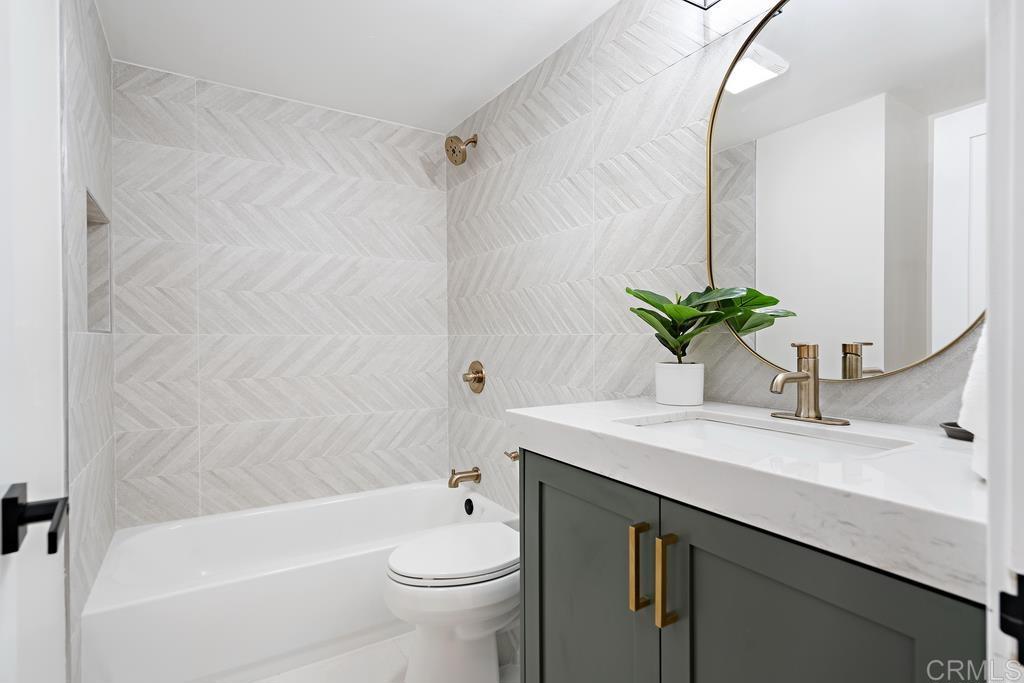 14224 Recuerdo Drive Del Mar, CA 92014 - Photo 16 of 21 a bathroom with a sink a toilet a tub and shower