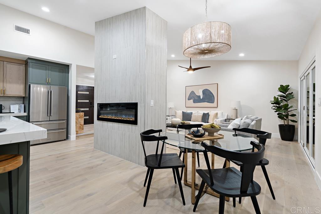 14224 Recuerdo Drive Del Mar, CA 92014 - Photo 4 of 21 a view of a dining room with furniture wooden floor and chandelier