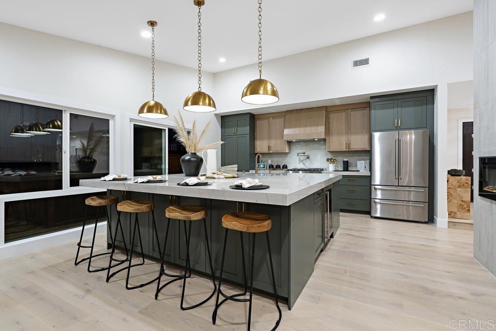 14224 Recuerdo Drive Del Mar, CA 92014 - Photo 9 of 21 a kitchen with a sink a counter space stainless steel appliances and cabinets