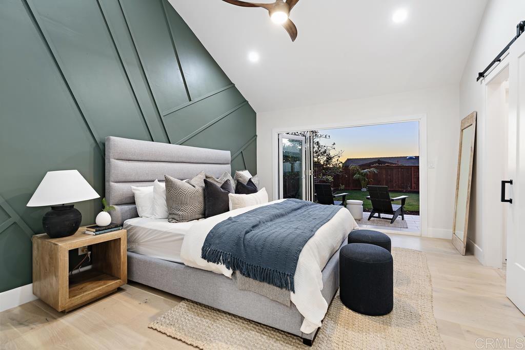 14224 Recuerdo Drive Del Mar, CA 92014 - Photo 10 of 21 a bedroom with a bed and a lamp