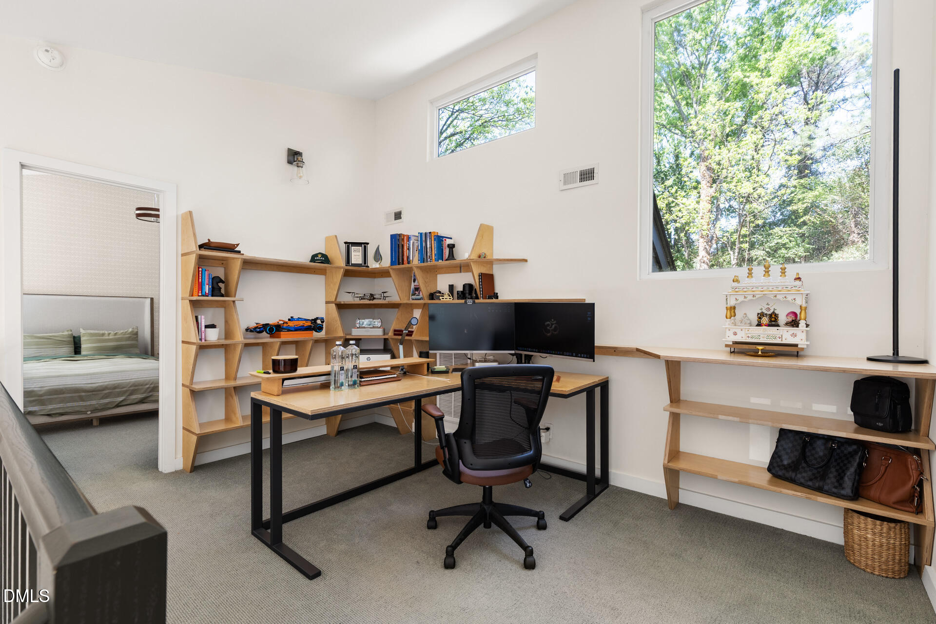 5208 Saddle Court Raleigh, NC 27609 - Photo 35 of 43 a view of a workspace with furniture and a window