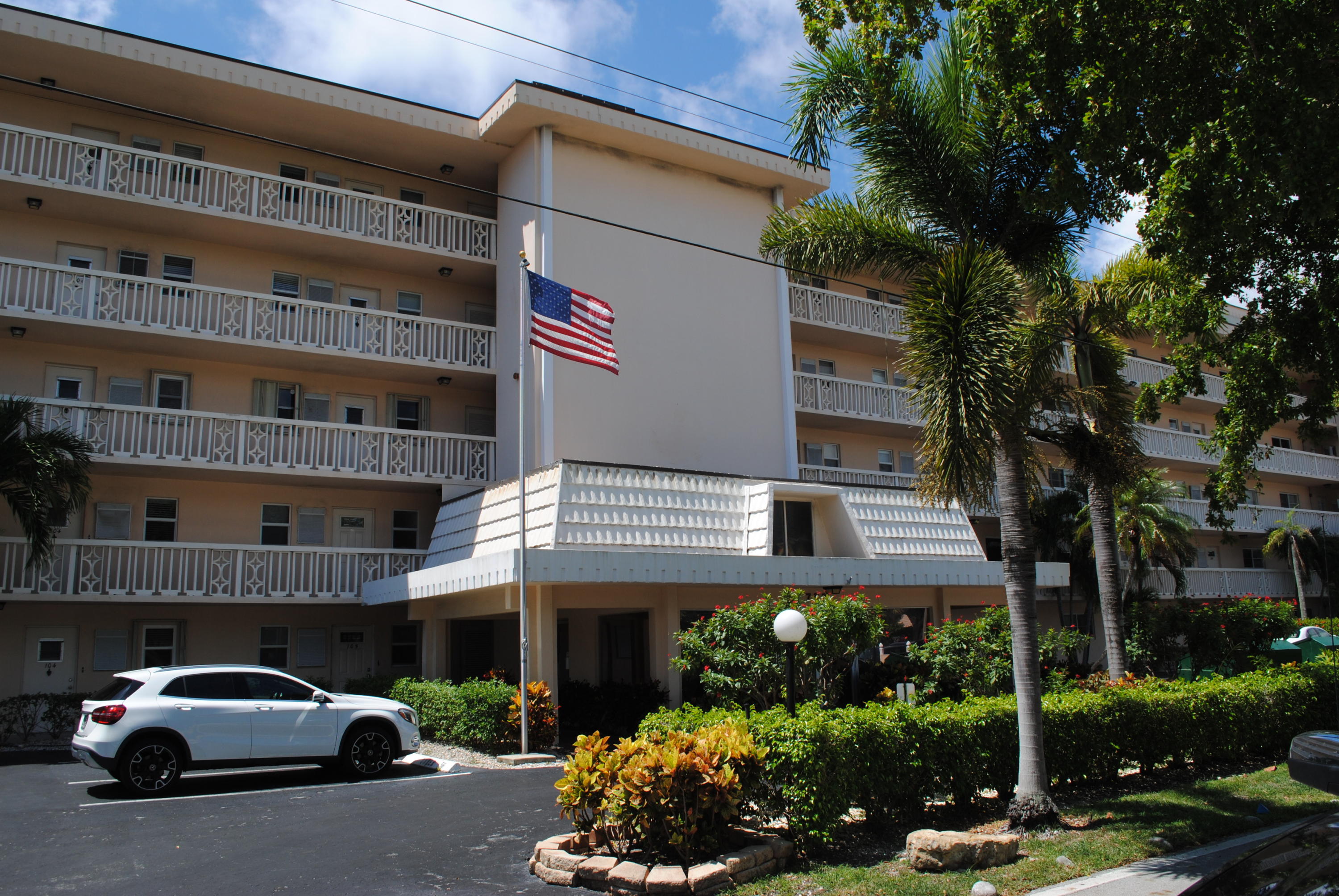 750 Northeast Spanish River Boulevard, Unit 503 Boca Raton, FL 33431 - Photo 31 of 32 a car parked in front of a building