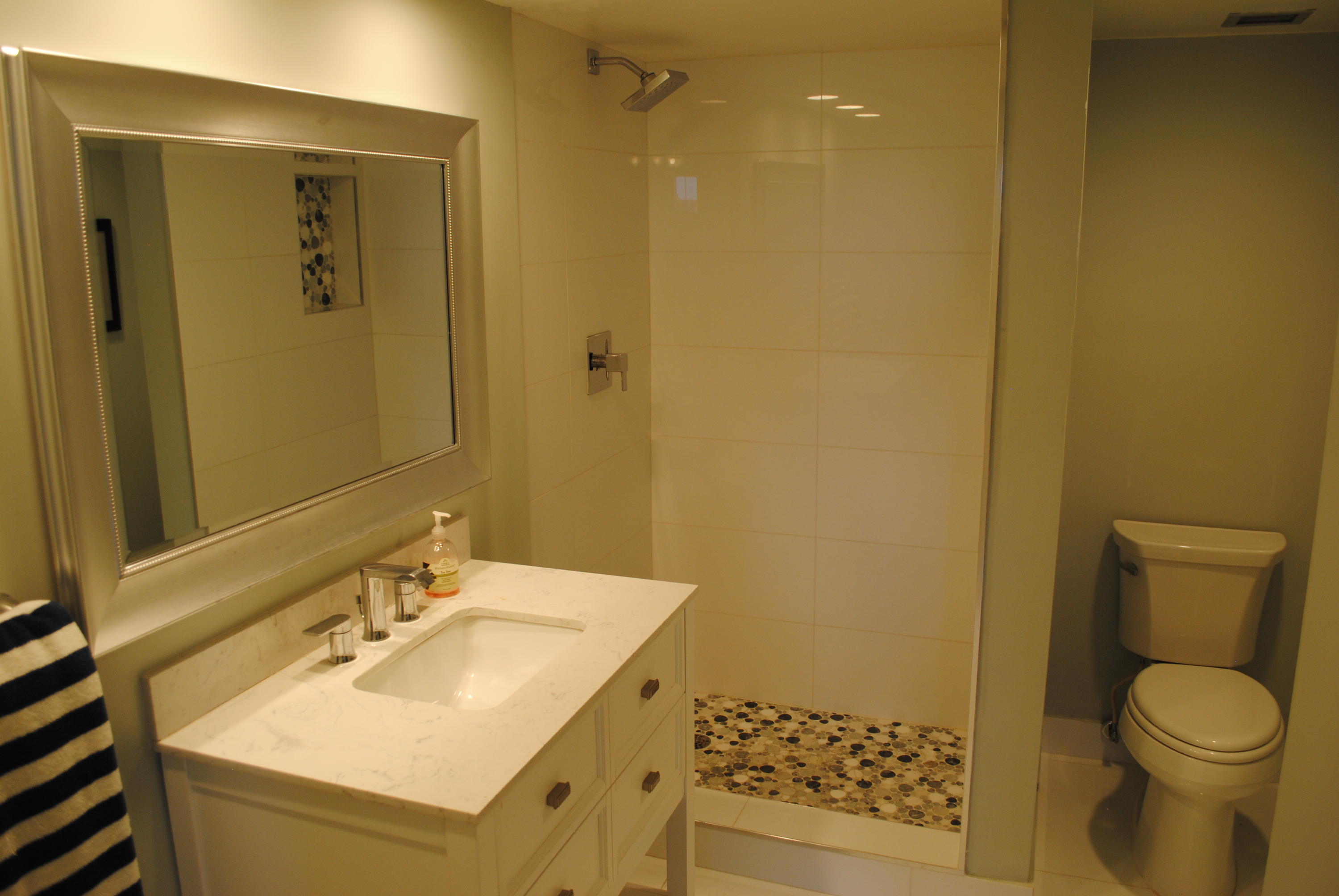 750 Northeast Spanish River Boulevard, Unit 503 Boca Raton, FL 33431 - Photo 10 of 32 a bathroom with a sink toilet and shower