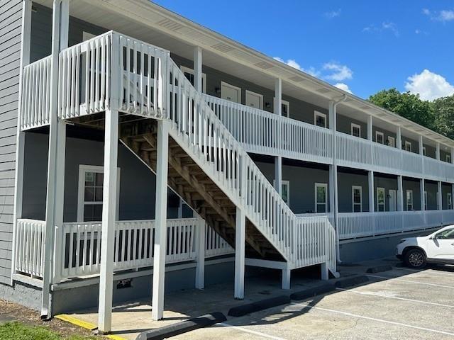 432 4th Avenue Dalton, GA 30721 - Photo 17 of 25 a view of a house with wooden stairs