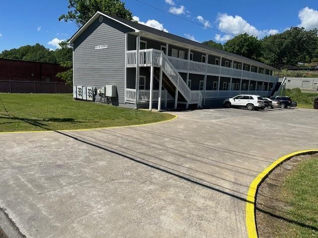 432 4th Avenue Dalton, GA 30721 - Photo 20 of 25 a front view of a house with a yard