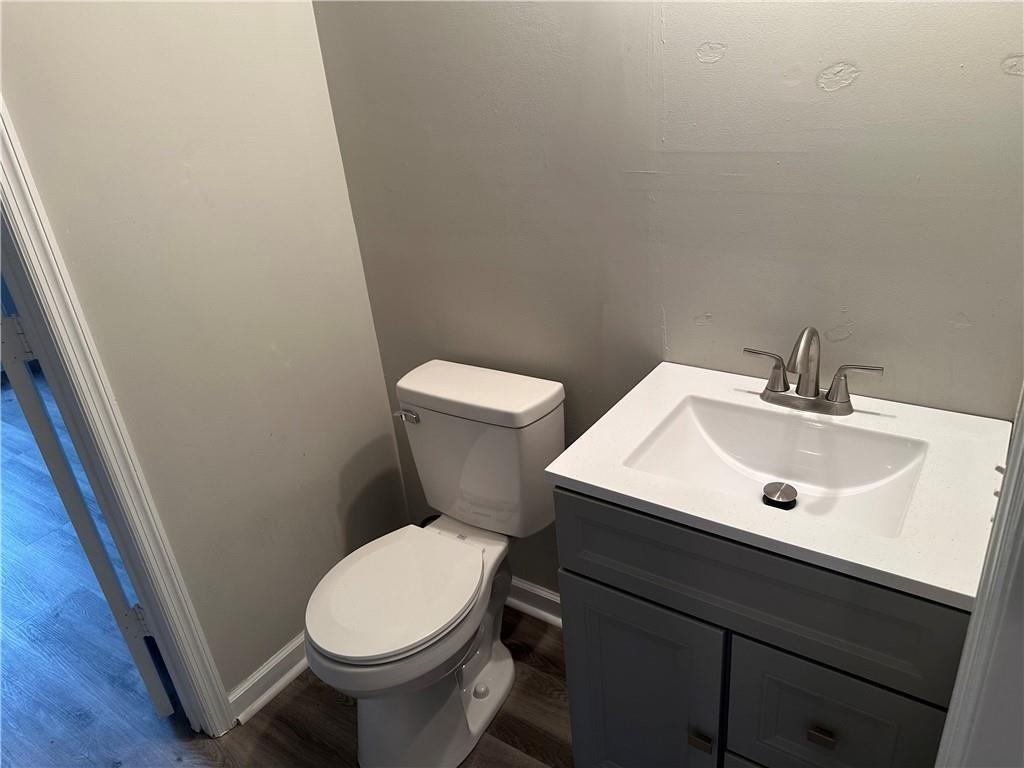 432 4th Avenue Dalton, GA 30721 - Photo 6 of 25 a white toilet sitting next to a bathroom sink
