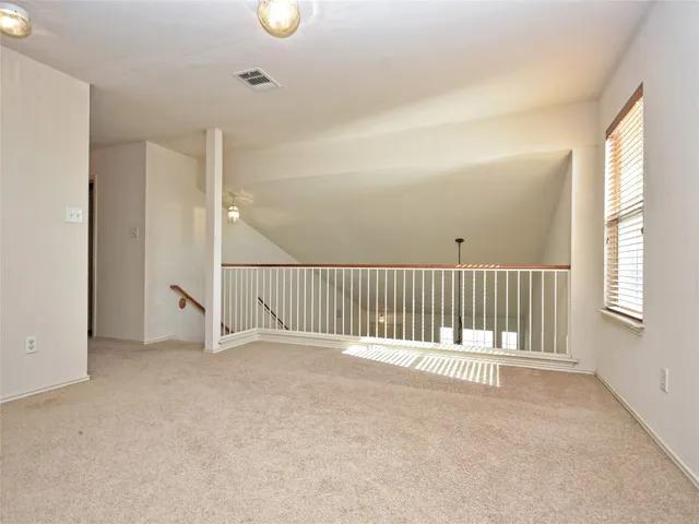 a view or kitchen with refrigerator and window