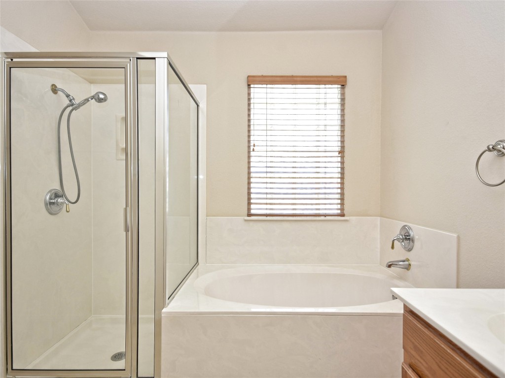 3600 Spring Canyon Trail Round Rock, TX 78681 - Photo 18 of 30 a bathroom with a bath tub with a shower
