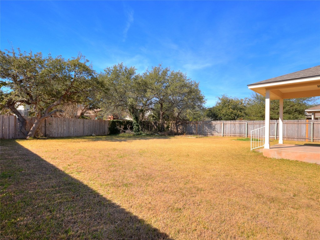 3600 Spring Canyon Trail Round Rock, TX 78681 - Photo 26 of 30 a view of a swimming pool with an outdoor seating and a yard