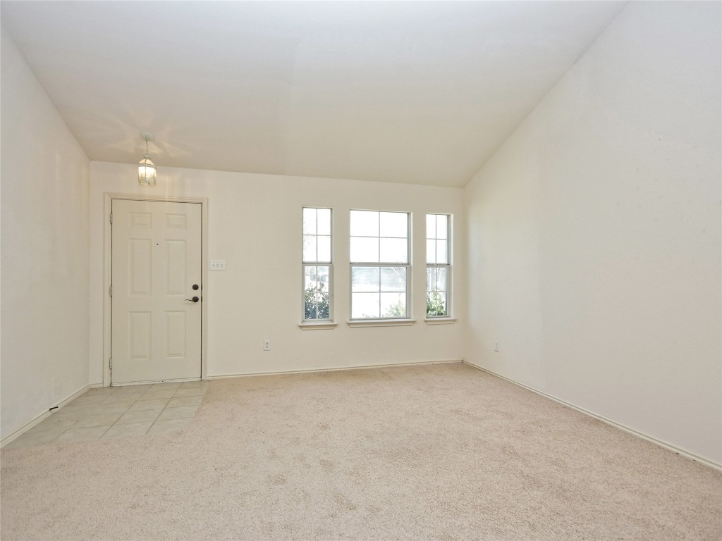 3600 Spring Canyon Trail Round Rock, TX 78681 - Photo 5 of 30 an empty room with a empty space and windows